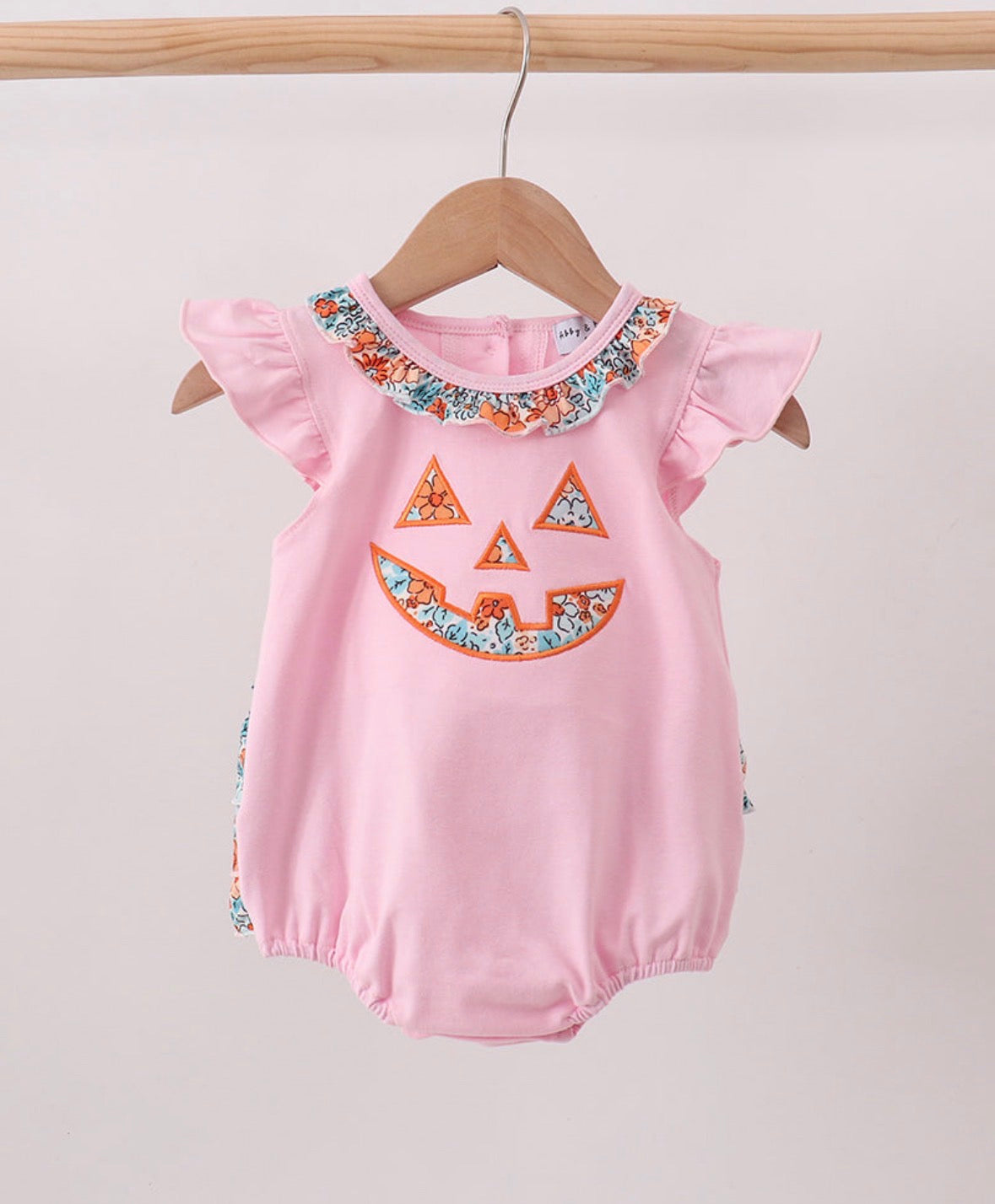 pink jack-o-lantern applique ruffle bubble